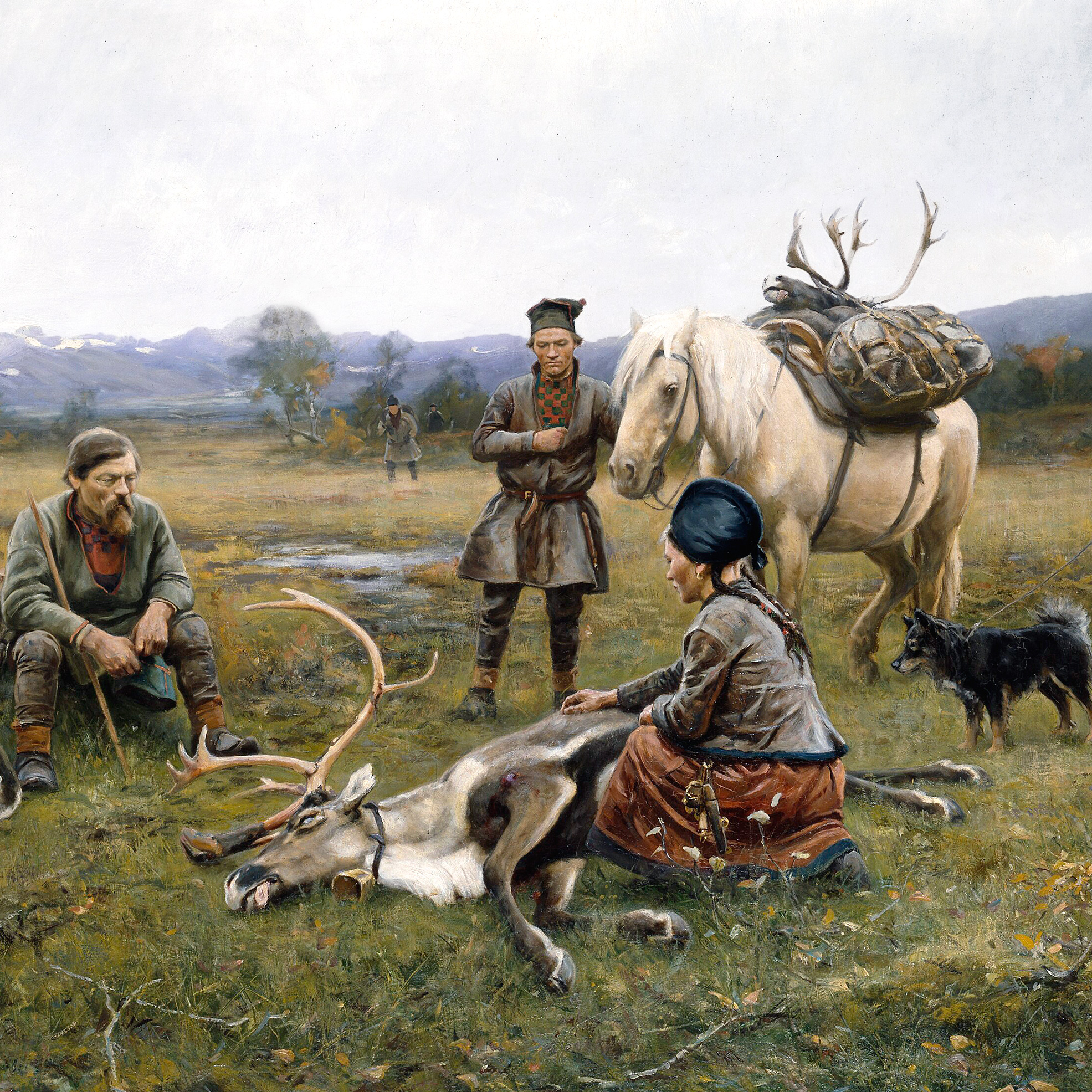 Tre samer som samlats kring en död ren i ett fjällandskap.