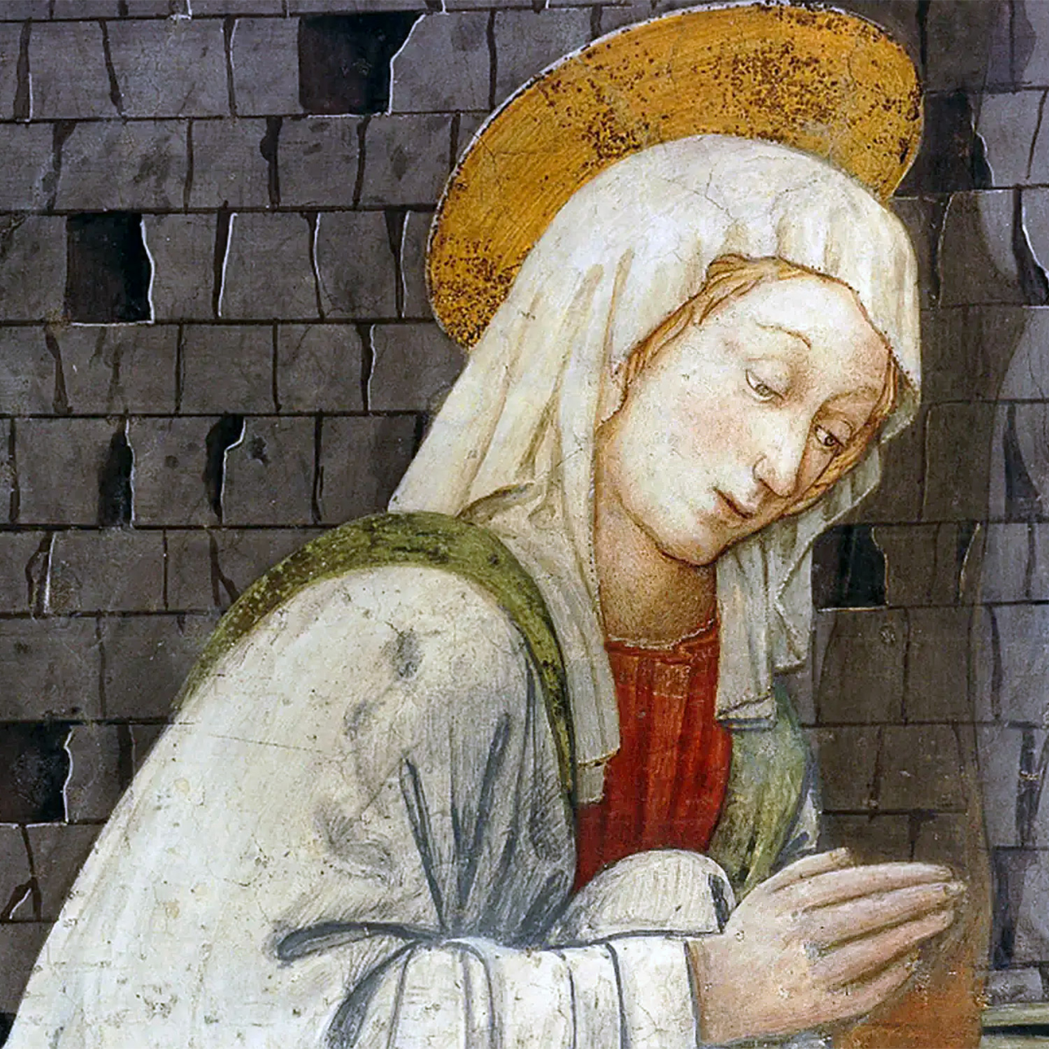 Jungfru Maria med gloria i bön.