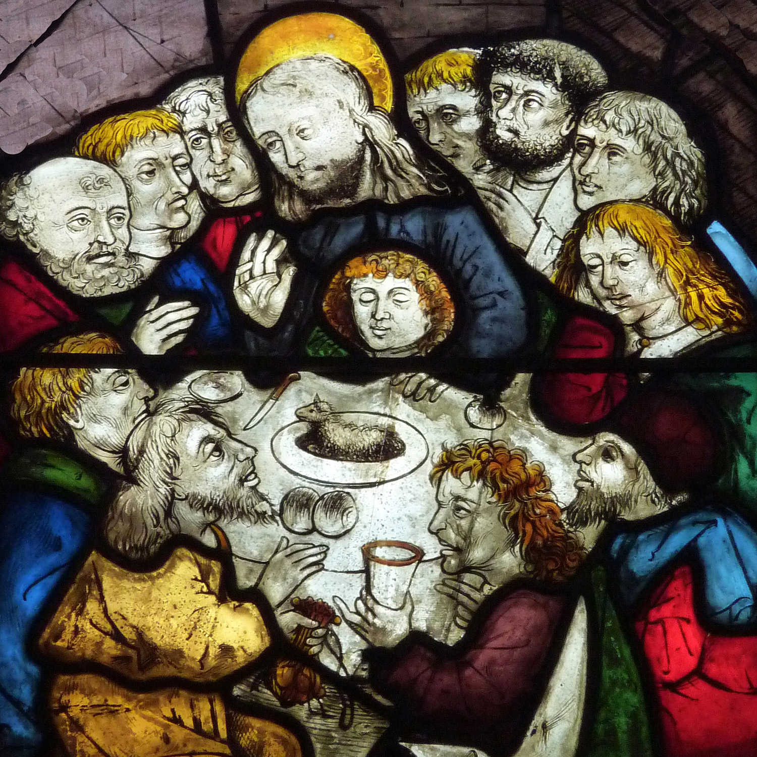 Motiv på ett blyinfattat fönster med Jesus och lärjungarna som äter tillsammans.