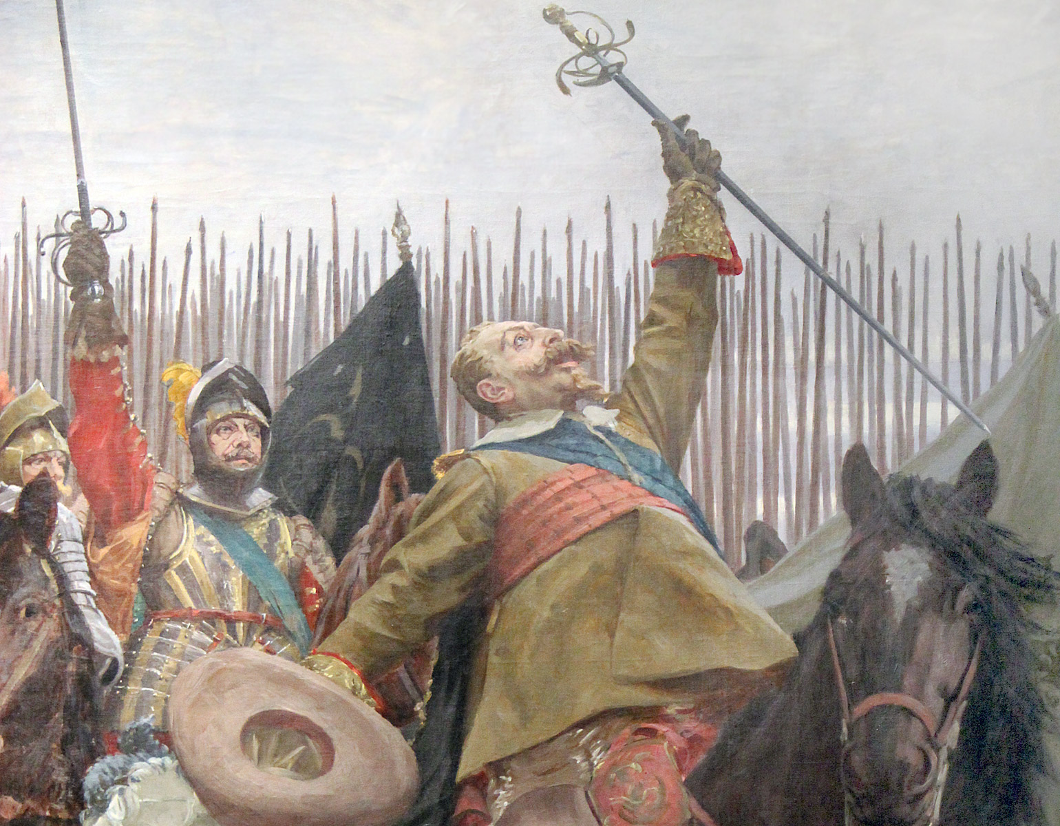 Kungen till häst framför sina trupper.