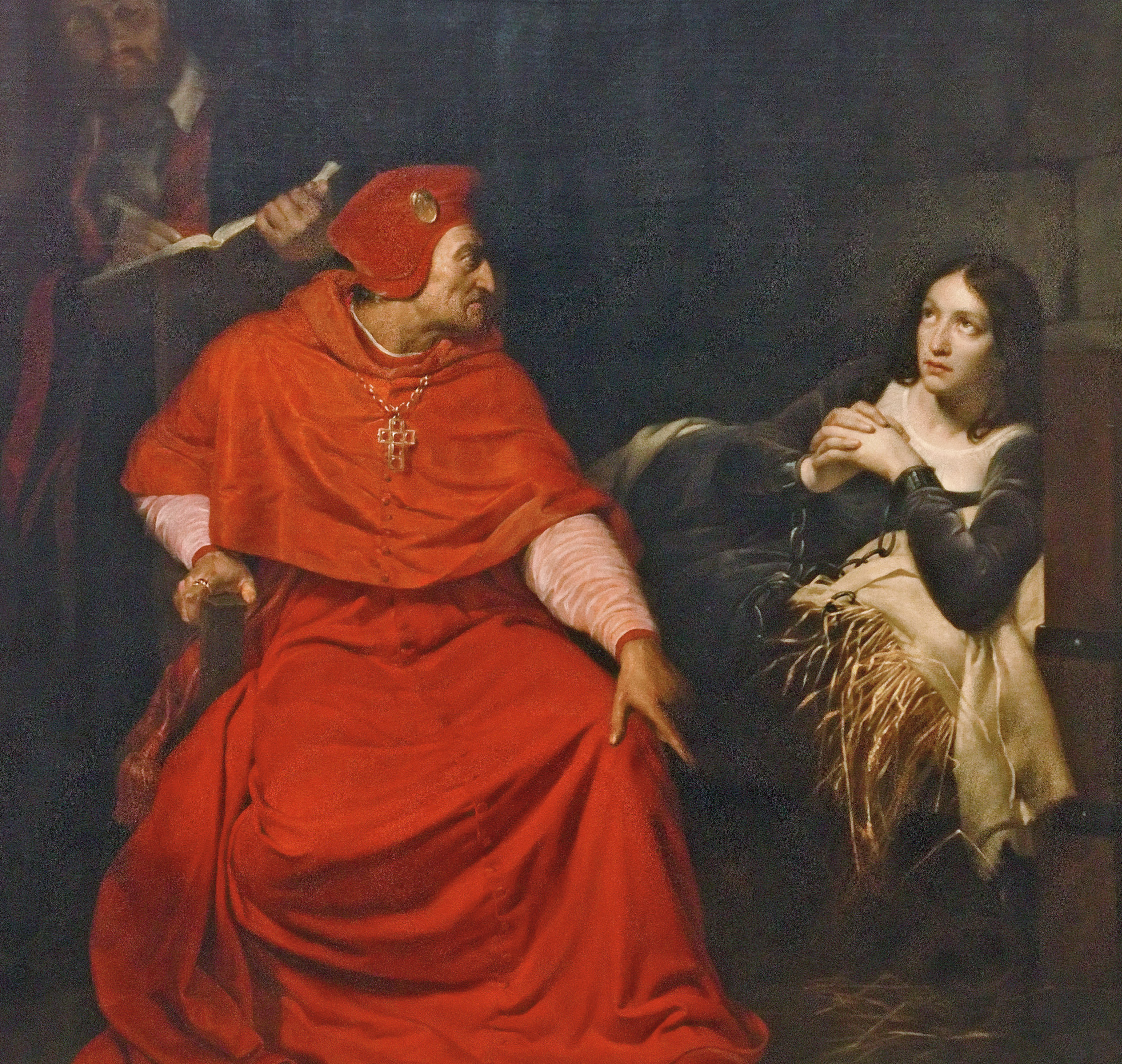 Jean förhörs i en fängelsehåla av en rödklädd kardinal.