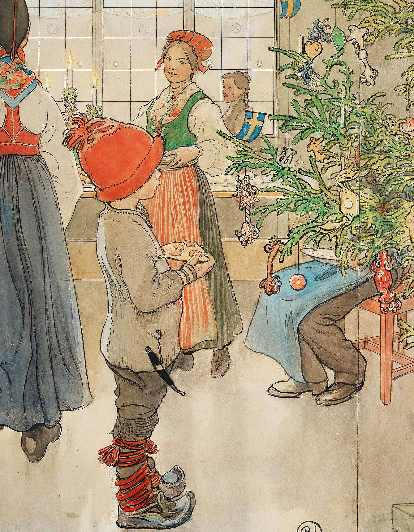 Pojke som tittar på en julgran.