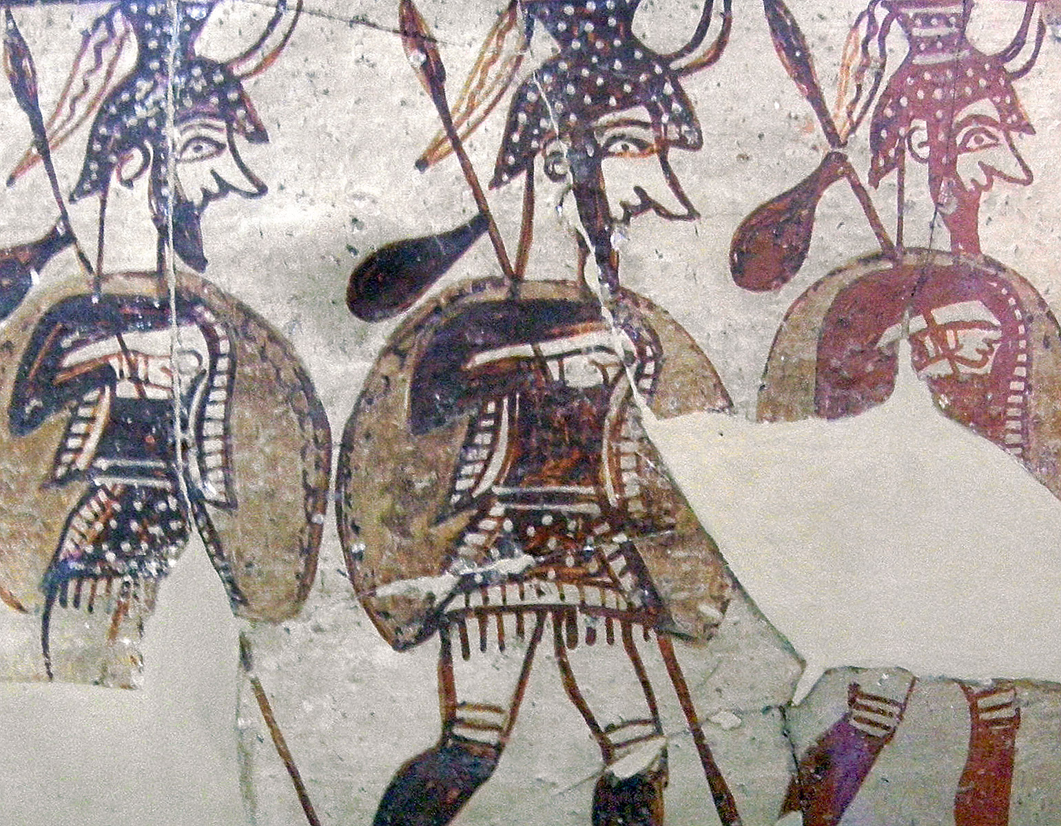 Tre krigare avbildade på en vas.