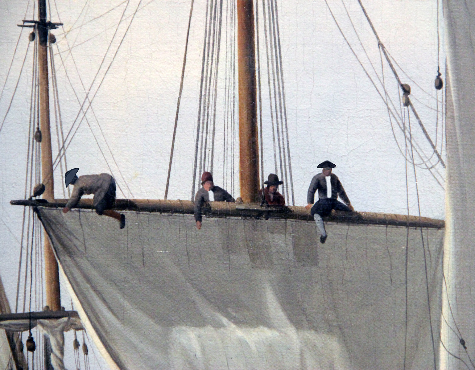 Fyra sjömän uppe i riggen på ett fartyg.