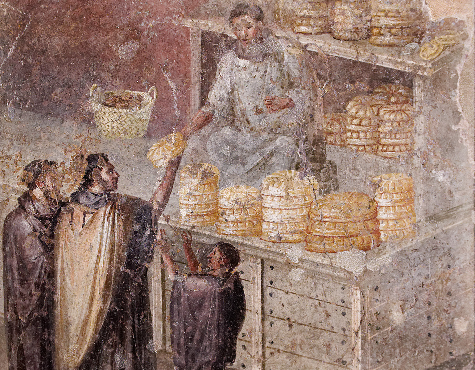 En bagare som säljer bröd till tre kunder i sin brödbutik.